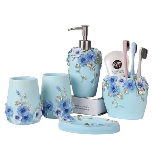 KTX-497491 Flower Pattern Polyresin Bathroom Accessory Set in Blue - Includes Lotion Dispenser, Toothbrush Holder, Soap Dish, Tumbler, Toilet Brush Holder, Amenity Tray, Tissue Cover, and Waste Bin